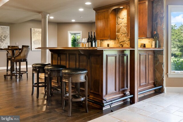 20550 Wildbrook Ct, Ashburn, VA 20147 - indoor dry bar with recessed lighting, baseboards, healthy amount of natural light, decorative columns, and backsplash
