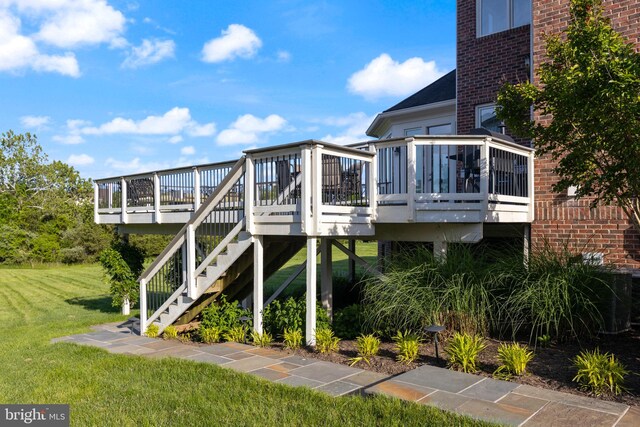 20550 Wildbrook Ct, Ashburn, VA 20147 - rear view of property featuring a deck, a lawn, stairs, and brick siding