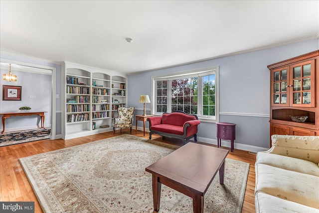1795 Hillcrest Ln, Aston, PA 19014 - living room featuring crown molding, wood finished floors, baseboards, and a chandelier