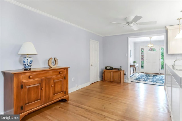 1795 Hillcrest Ln, Aston, PA 19014 - foyer featuring light wood-style flooring, a ceiling fan, crown molding, and baseboards