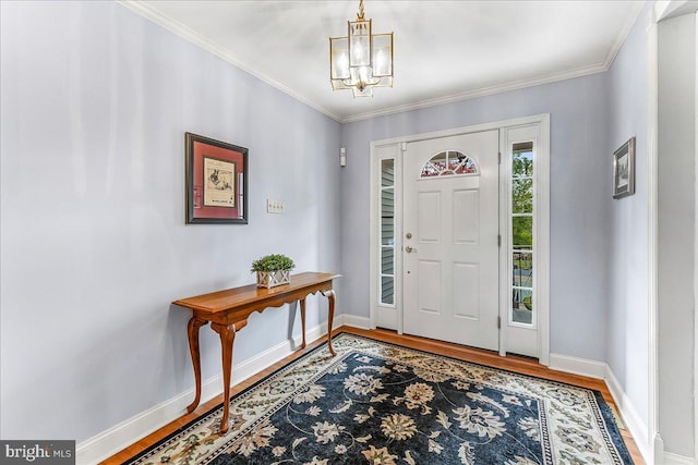 1795 Hillcrest Ln, Aston, PA 19014 - entryway featuring wood finished floors, a chandelier, baseboards, and ornamental molding