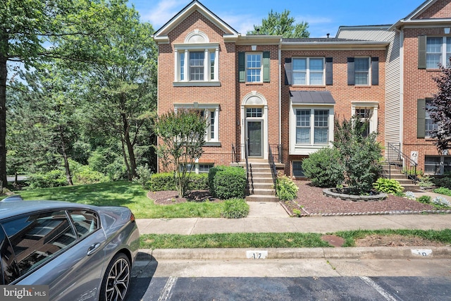 5561 Jowett Ct, Alexandria, VA 22315 - view of property with uncovered parking and brick siding