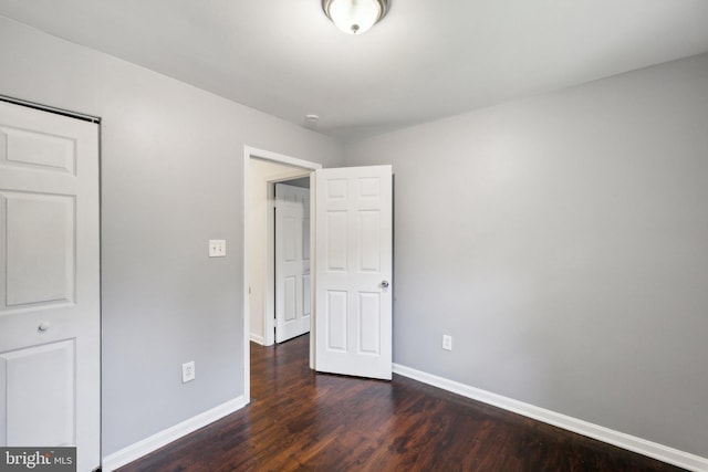 12991 Orleans St, Woodbridge, VA 22192 - unfurnished bedroom with dark wood finished floors and baseboards