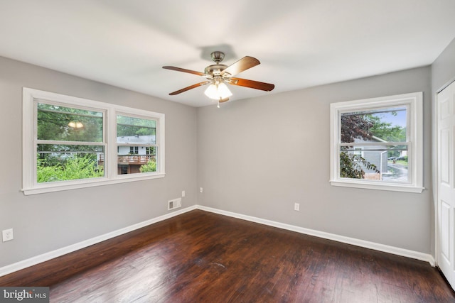 12991 Orleans St, Woodbridge, VA 22192 - spare room featuring baseboards, dark wood-style flooring, and a ceiling fan