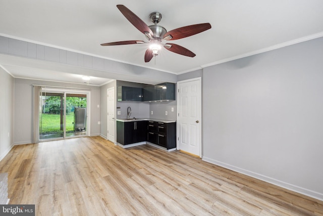 12991 Orleans St, Woodbridge, VA 22192 - unfurnished living room with ornamental molding, light wood-style flooring, wet bar, baseboards, and a ceiling fan