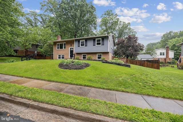 12991 Orleans St, Woodbridge, VA 22192 - bi-level home featuring a chimney and brick siding