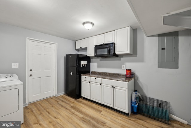 12991 Orleans St, Woodbridge, VA 22192 - kitchen featuring washer / clothes dryer, black appliances, electric panel, light wood-style floors, and white cabinets