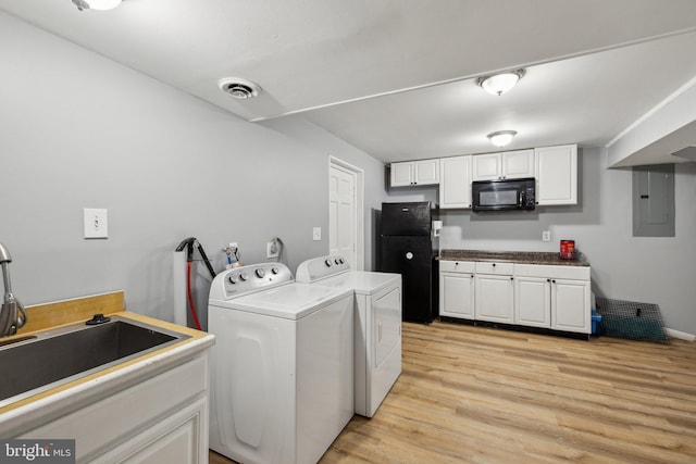 12991 Orleans St, Woodbridge, VA 22192 - washroom featuring washing machine and dryer, electric panel, and light wood finished floors
