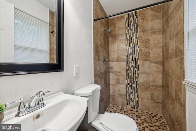12991 Orleans St, Woodbridge, VA 22192 - bathroom featuring toilet, tiled shower, and vanity