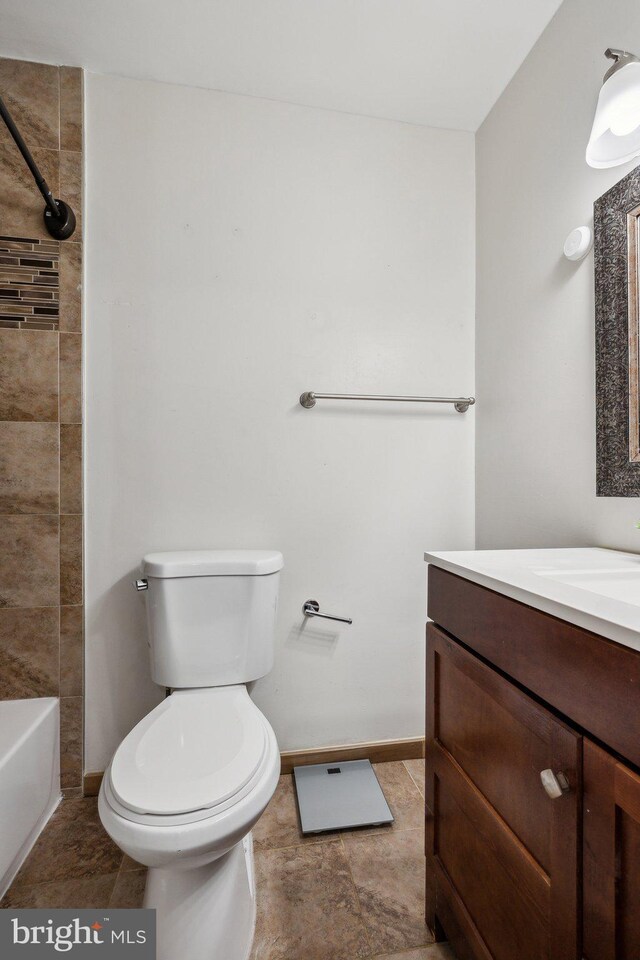 12991 Orleans St, Woodbridge, VA 22192 - bathroom featuring vanity, toilet, and baseboards