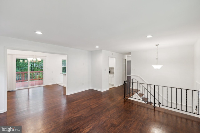 12991 Orleans St, Woodbridge, VA 22192 - unfurnished room with a chandelier, dark wood-style floors, recessed lighting, and baseboards