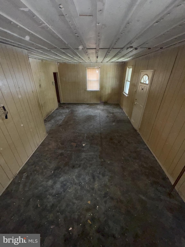 below grade area featuring wood walls