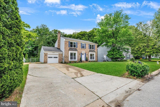 colonial house featuring brick siding, a garage, concrete driveway, and a chimney