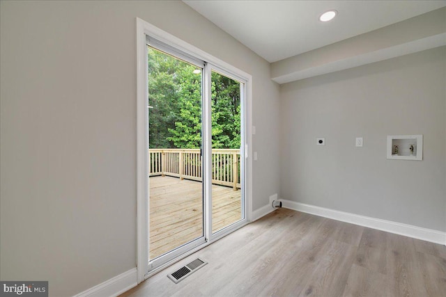 entryway with baseboards and wood finished floors