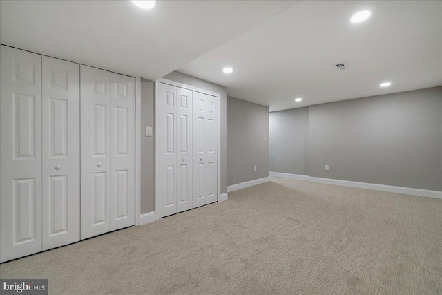 finished basement featuring carpet flooring, baseboards, and recessed lighting