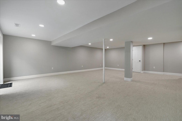 finished basement with light carpet, baseboards, and recessed lighting