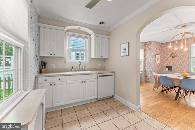 119 Burke, Towson, MD 21286 - kitchen featuring dishwasher, a sink, light countertops, arched walkways, and wallpapered walls