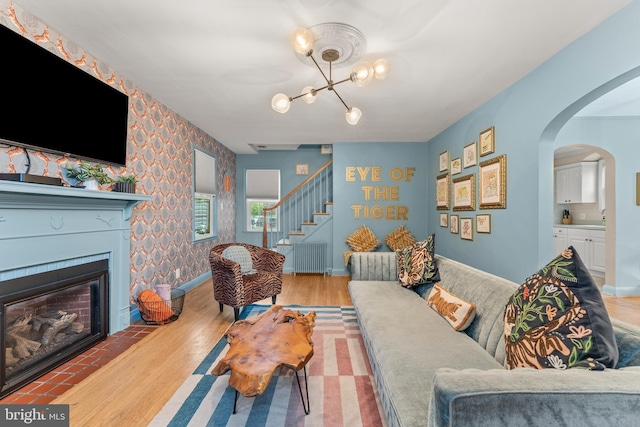 119 Burke, Towson, MD 21286 - living area featuring wood finished floors, wallpapered walls, stairway, baseboards, and a chandelier