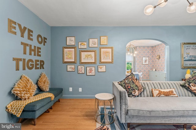 119 Burke, Towson, MD 21286 - living room featuring wood finished floors, arched walkways, and baseboards
