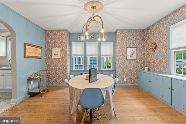 119 Burke, Towson, MD 21286 - dining area featuring arched walkways, light wood-style flooring, baseboards, ornamental molding, and wallpapered walls