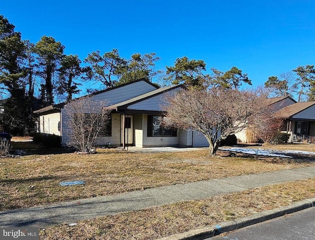24 Mariner Pl, Brick, NJ 08723 - view of front of home with an attached garage and a front lawn