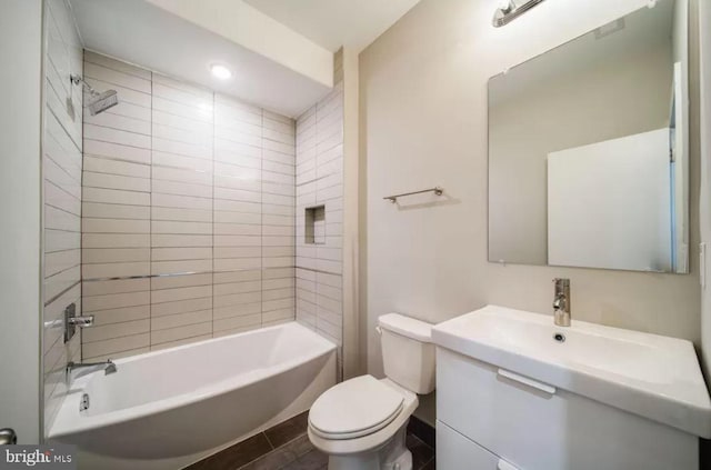 full bathroom featuring toilet, vanity, and shower / washtub combination