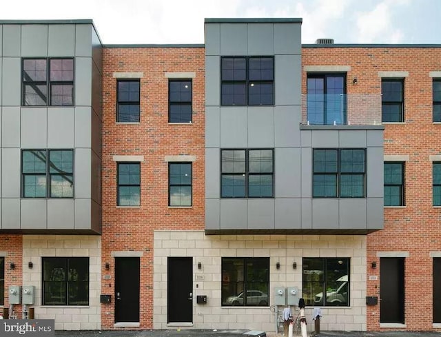 view of front of house featuring brick siding