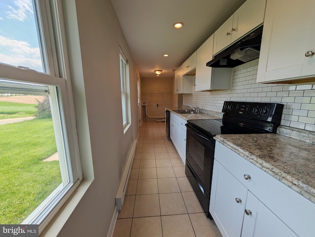 5809 Old Rte 22, Bernville, PA 19506 - kitchen with under cabinet range hood, black appliances, a sink, baseboards, and recessed lighting