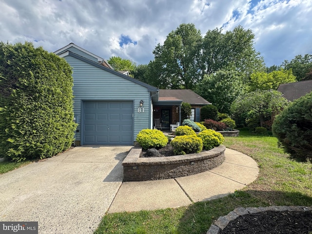 view of front of home with an attached garage and concrete driveway