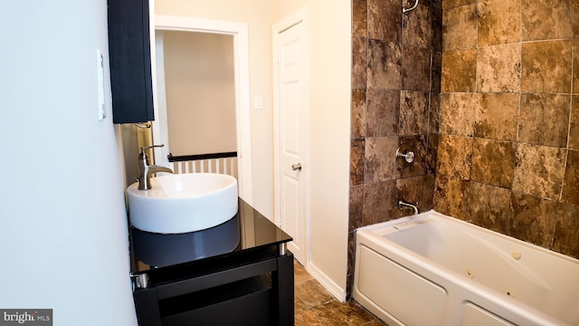 full bath with  shower combination and a sink
