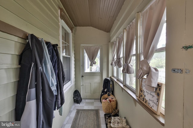mudroom featuring wood ceiling, vaulted ceiling, and plenty of natural light