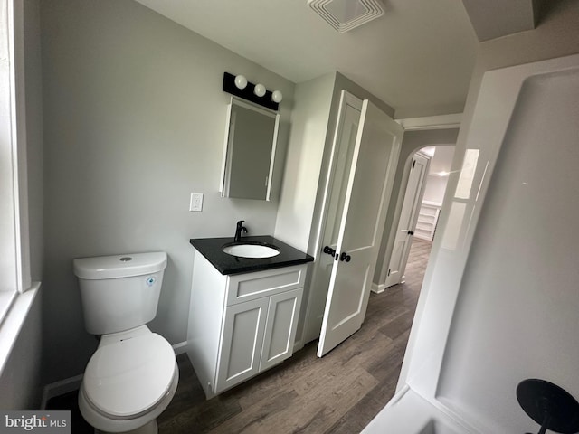 3333 Stone Ridge Rd, York, PA 17402 - bathroom featuring wood finished floors, toilet, vanity, and baseboards