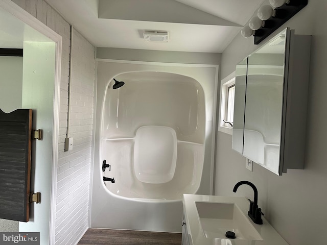 3333 Stone Ridge Rd, York, PA 17402 - bathroom featuring vanity, washtub / shower combination, and wood finished floors