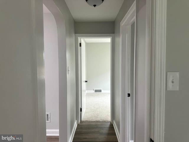3333 Stone Ridge Rd, York, PA 17402 - hallway featuring dark wood-style flooring, baseboards, and arched walkways