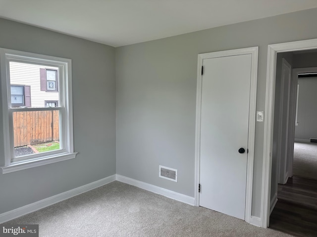3333 Stone Ridge Rd, York, PA 17402 - unfurnished bedroom featuring baseboards and dark colored carpet