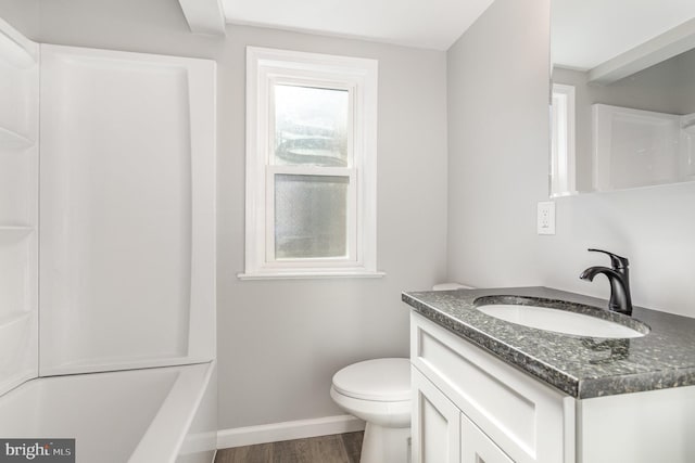 3333 Stone Ridge Rd, York, PA 17402 - bathroom featuring vanity, wood finished floors, baseboards, toilet, and shower / tub combination