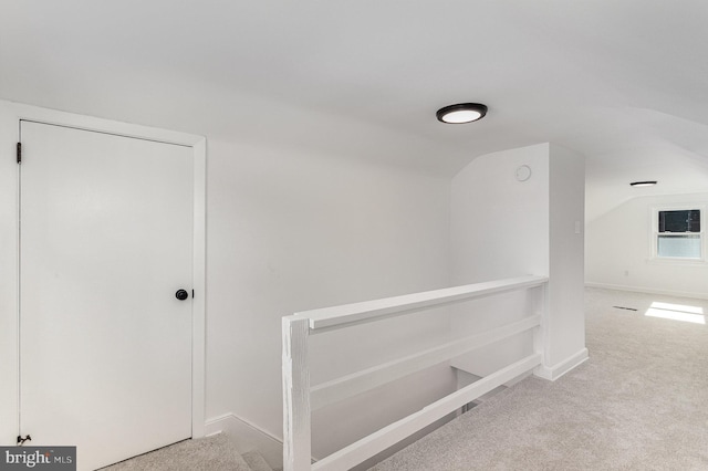 3333 Stone Ridge Rd, York, PA 17402 - hallway with carpet floors, an upstairs landing, lofted ceiling, and baseboards
