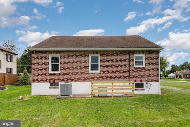 3333 Stone Ridge Rd, York, PA 17402 - rear view of property featuring central AC unit, roof with shingles, and brick siding