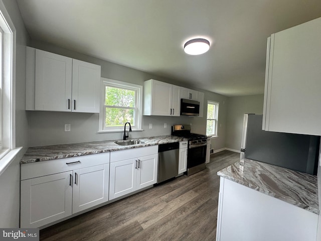 3333 Stone Ridge Rd, York, PA 17402 - kitchen with stainless steel appliances, a sink, dark wood-style flooring, white cabinetry, and healthy amount of natural light