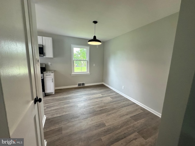 3333 Stone Ridge Rd, York, PA 17402 - unfurnished dining area featuring dark wood finished floors and baseboards