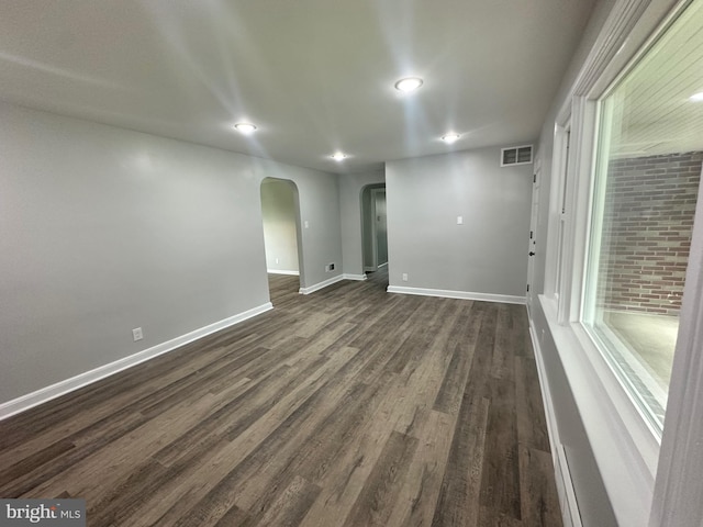 3333 Stone Ridge Rd, York, PA 17402 - unfurnished room featuring arched walkways, dark wood-style flooring, baseboards, and recessed lighting