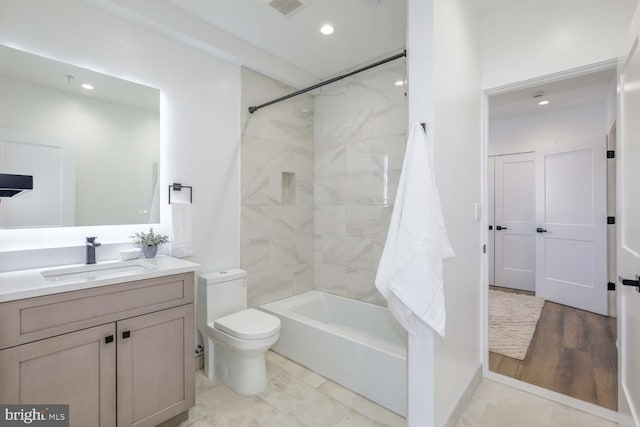 full bath featuring vanity, toilet, shower / tub combination, and recessed lighting