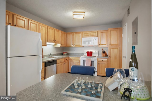 205 E Joppa Rd Unit 608, Towson, MD 21286 - kitchen with white appliances, light brown cabinetry, a sink, and a textured ceiling