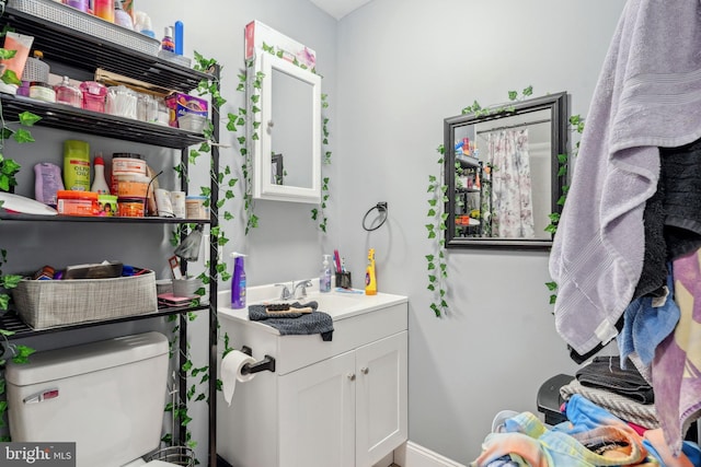 laundry room with a sink and baseboards