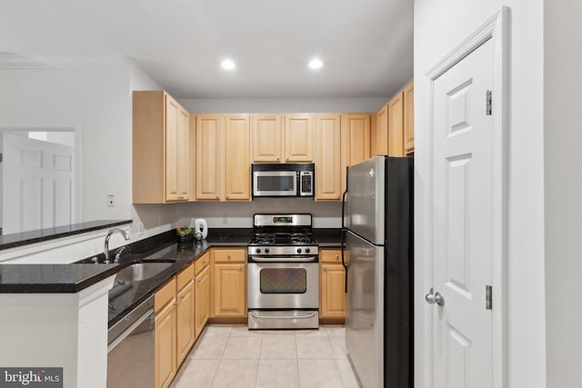 2301 25th St S Unit 4-303, Arlington, VA 22206 - kitchen featuring stainless steel appliances, light brown cabinets, a sink, light tile patterned flooring, and recessed lighting