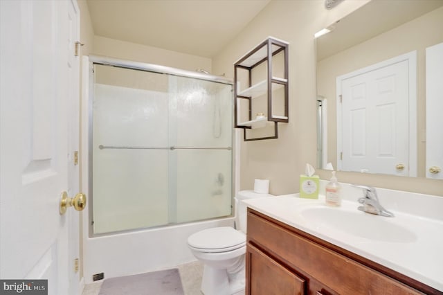 1550 Matthew Dr, York, PA 17404 - bathroom featuring vanity, toilet, tile patterned flooring, and combined bath / shower with glass door