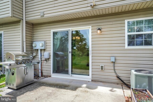 1550 Matthew Dr, York, PA 17404 - doorway to property with central AC and a patio area