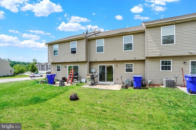 1550 Matthew Dr, York, PA 17404 - back of property featuring a patio area, central air condition unit, a lawn, and an outdoor fire pit
