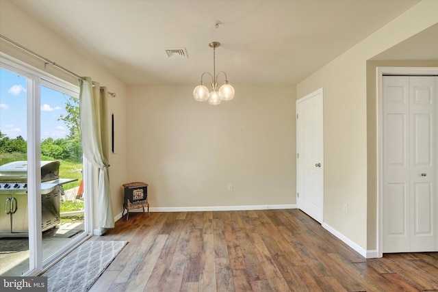 1550 Matthew Dr, York, PA 17404 - unfurnished dining area featuring hardwood / wood-style flooring, baseboards, and a chandelier