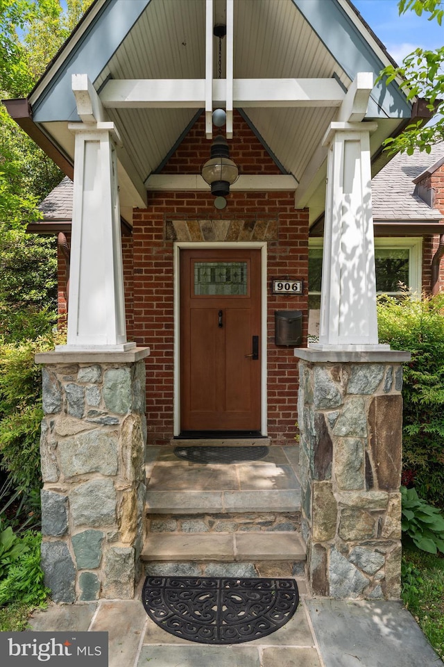 entrance to property with brick siding